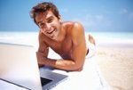 man-having-fun-while-using-laptop-on-beach.jpg